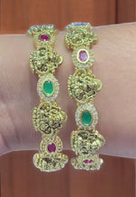 Load image into Gallery viewer, Beautiful bangles with God laxmi motive and ruby, green stone -embrace the beauty in you