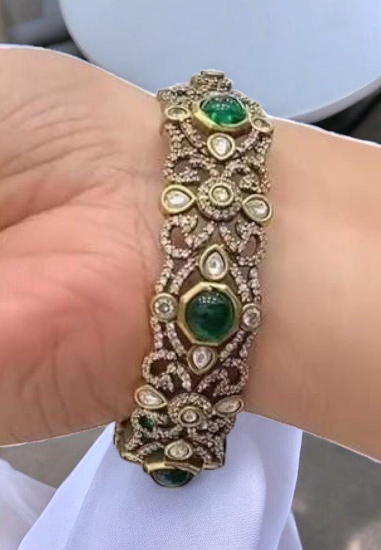 Stunning Victorian polish bangle with green stone