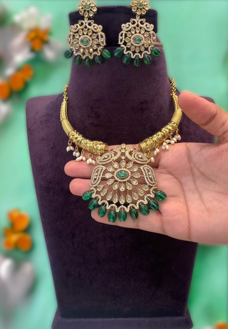 Victorian polish simple kanti neck piece with green stone pendant and beautiful earrings