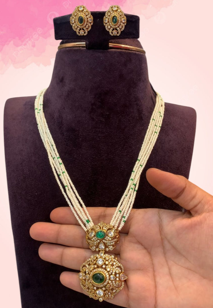Beautiful white pearl mala with green stone pendant