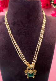 Three layer pearls set with green stone -perfect for any occasion