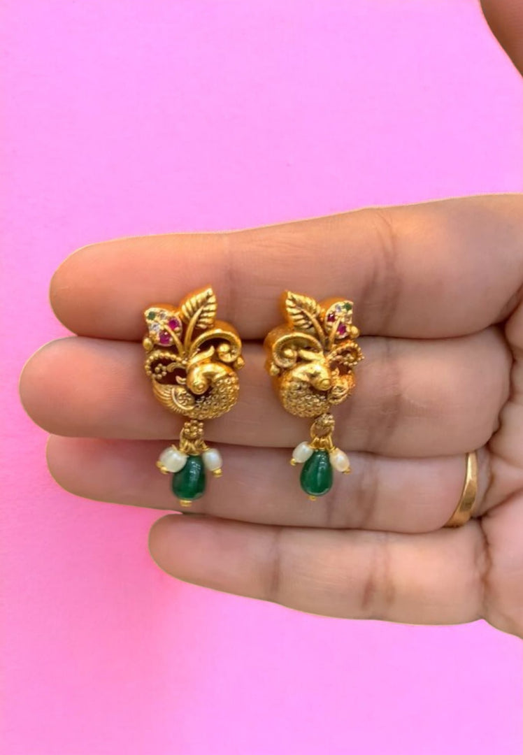 Beautiful earrings with peacock design and green stone