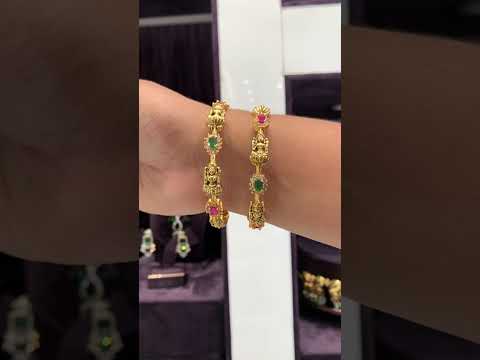 Traditional nakshi bangles with green and pink stone