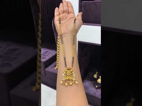 Beautiful black beads chain with Laxmi Devi motive pendant