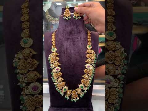 Beautiful long haram with green beads and Laxmi Devi motive