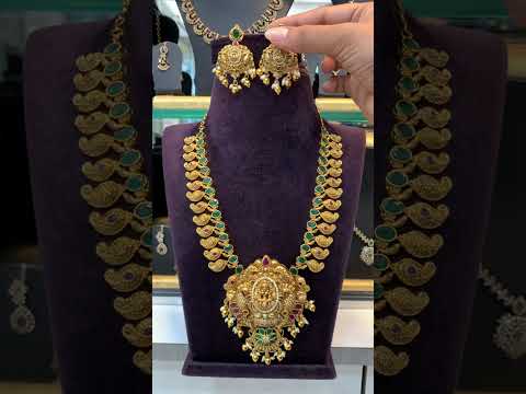 Beautiful short necklace with green stone and Laxmi Devi motive