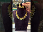 Load and play video in Gallery viewer, Beautiful short necklace with green stone and Laxmi Devi motive
