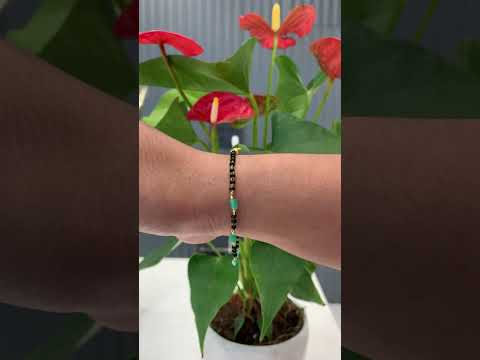 Beautiful black beads bracelet with green beads