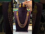 Load and play video in Gallery viewer, Beautiful three layer long haram with ruby stone and Laxmi Devi motive
