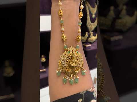 Beautiful black beads chain with green beads and Laxmi Devi motive pendant