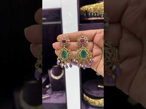 Beautiful earrings with purple stone