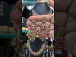 Load and play video in Gallery viewer, Beautiful chandbali earrings with green and ruby beads
