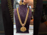 Load and play video in Gallery viewer, Beautiful nakshi polish long haram with ruby colour stone and God laxmi motive pendant -pairing with beautiful earrings
