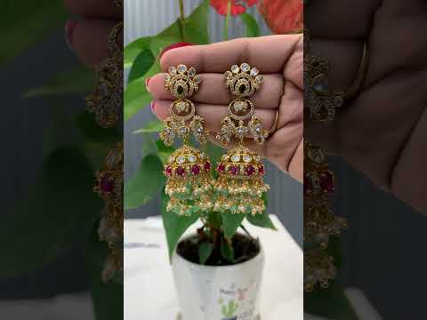 Beautiful jumkhas with peacock design and pink stone