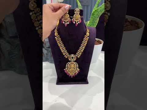 Beautiful short necklace with ruby beads and Laxmi Devi motive pendant