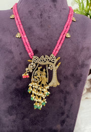 Beautiful beads haram with coral beads and radha krishna pendant