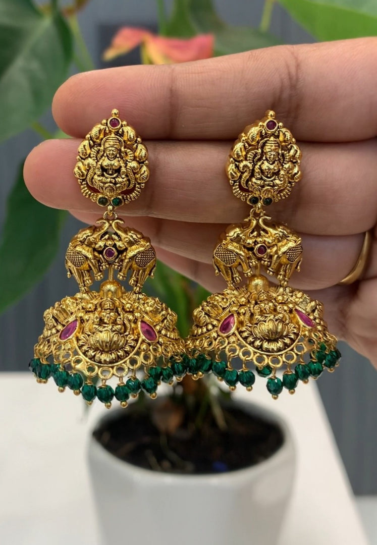 Traditional jumkhas with green beads and Laxmi Devi motive