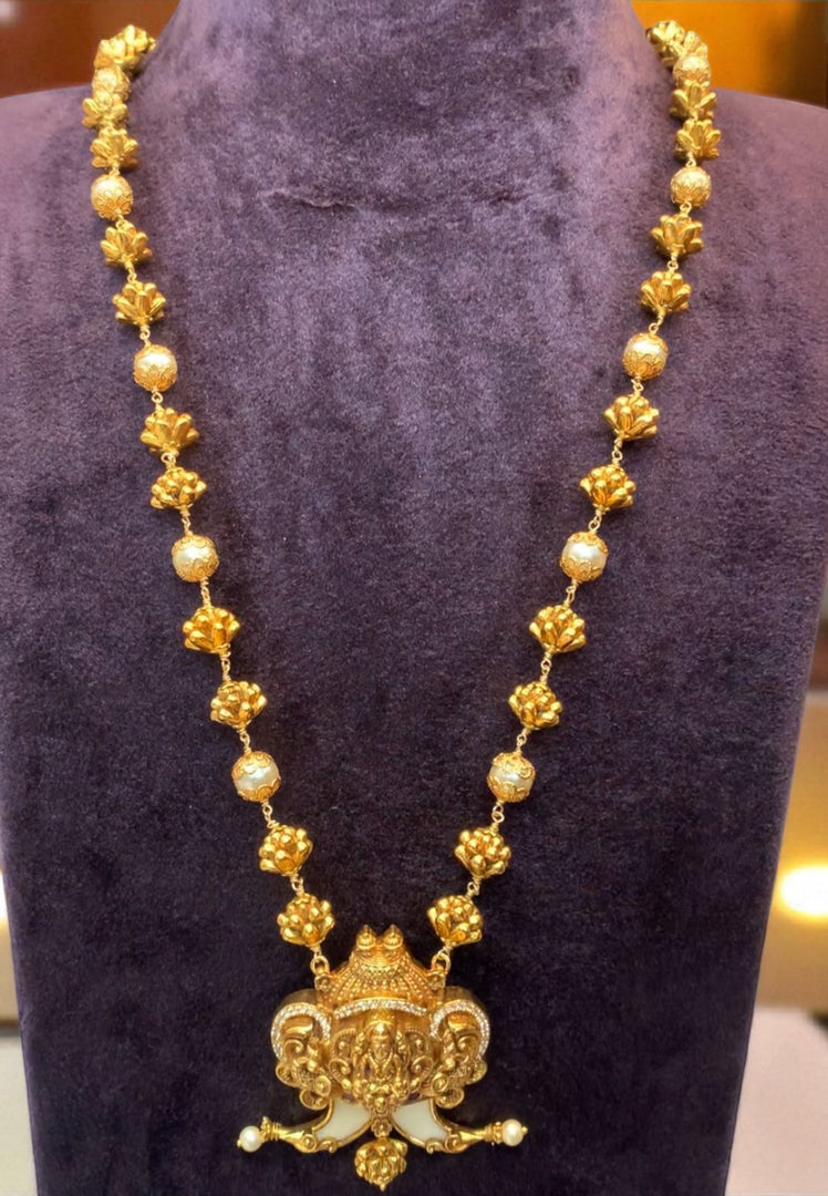 Traditional beads haram with puligoru design pendant and Laxmi Devi motive