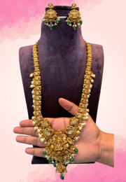 Traditional long haram with green stone and God Laxmi Devi motive