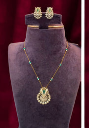 Unique invisible chain with green stone and uncut stone