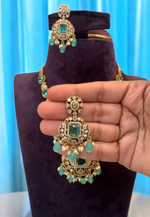 Load image into Gallery viewer, Beautiful short necklace with sea green stone and gold finishing

