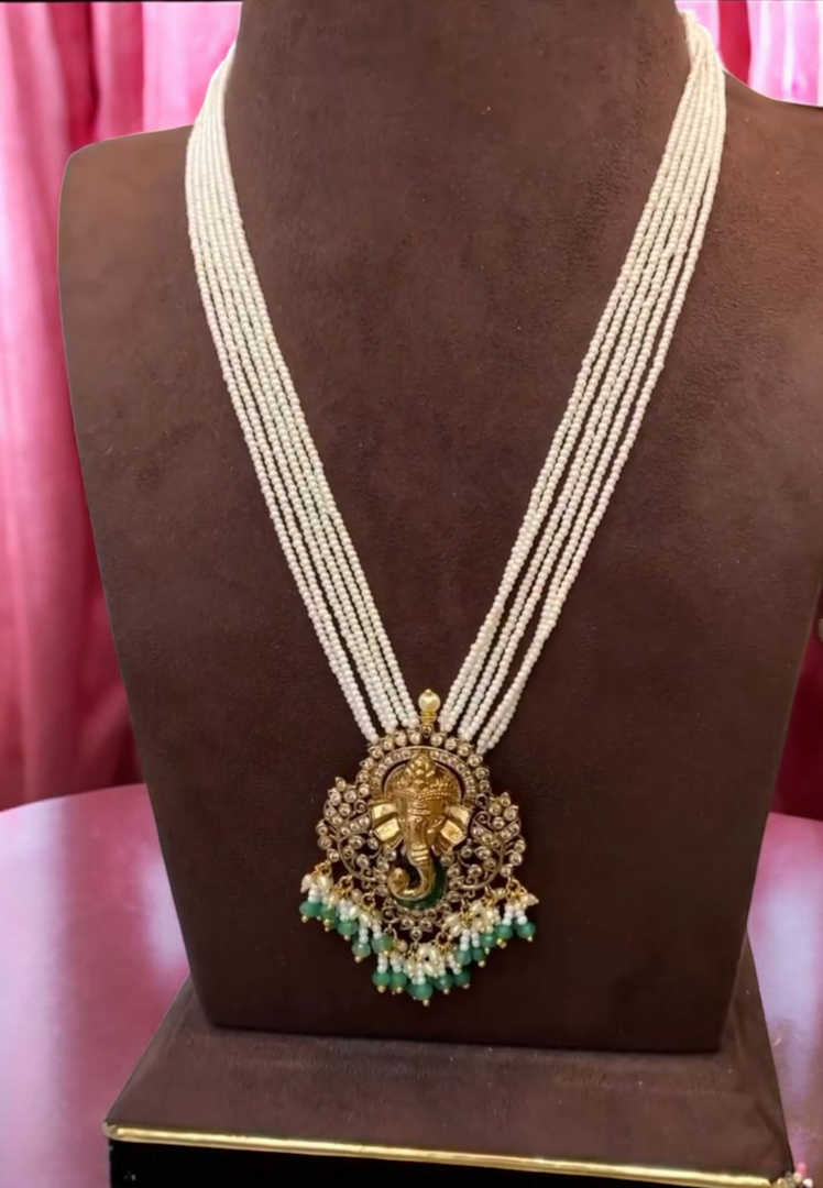 Stunning white beaded short haram with Lord Ganesha motive