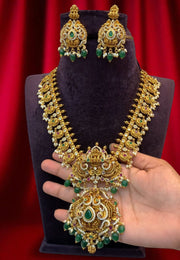 Traditional short haram with green beads and guttapusalu hangings