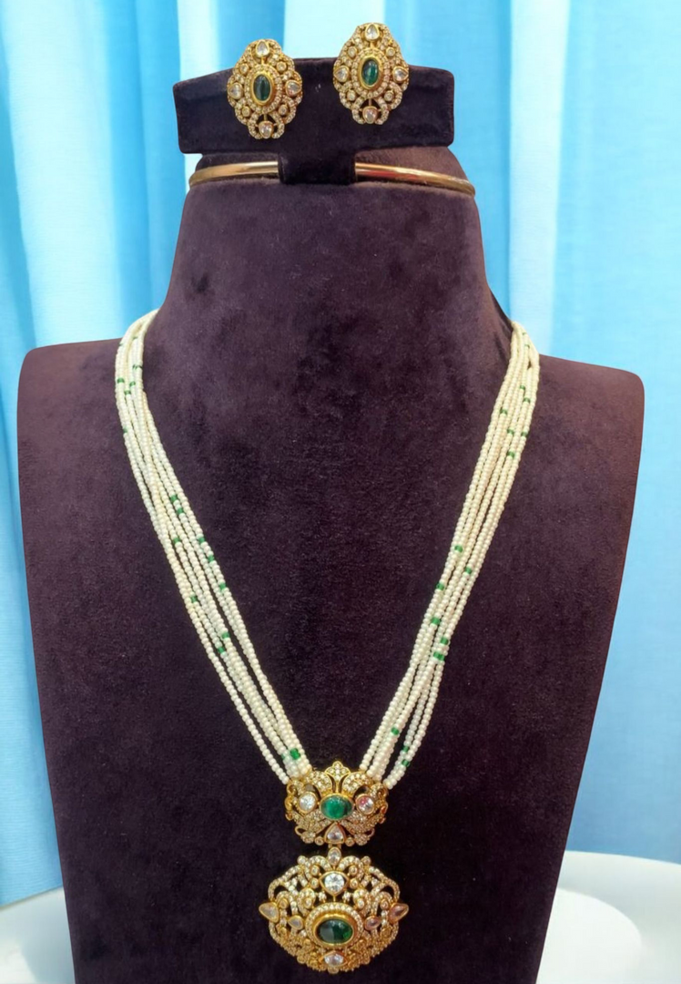 Beautiful white pearl mala with green stone pendant
