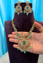 Load image into Gallery viewer, Beautiful short necklace with sea green stone and gold finishing
