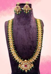 Traditional kundan stone long haram with red colour stones