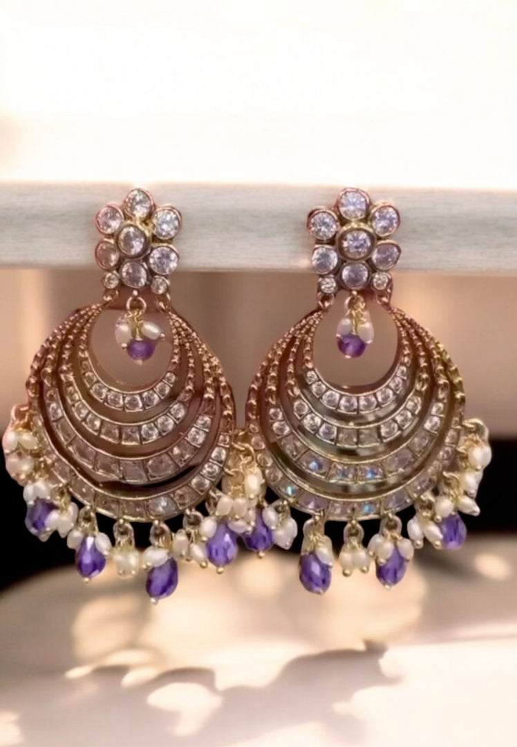 Beautiful earrings with purple colour stones