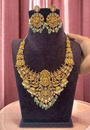 Traditional short haram with green stone and guttapusalu hangings