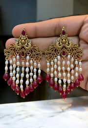 Beautiful earrings with peacock design and hanging with guttapusalu and red colour stone