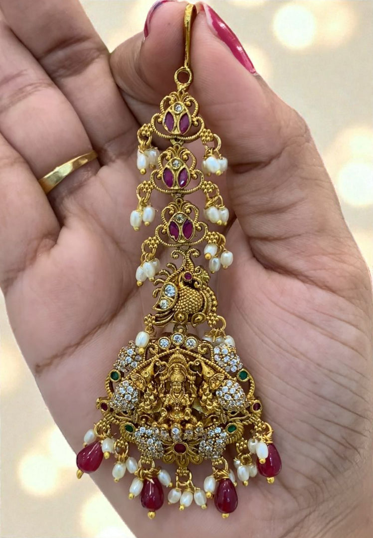 Traditional tikka with ruby beads and Laxmi Devi motive