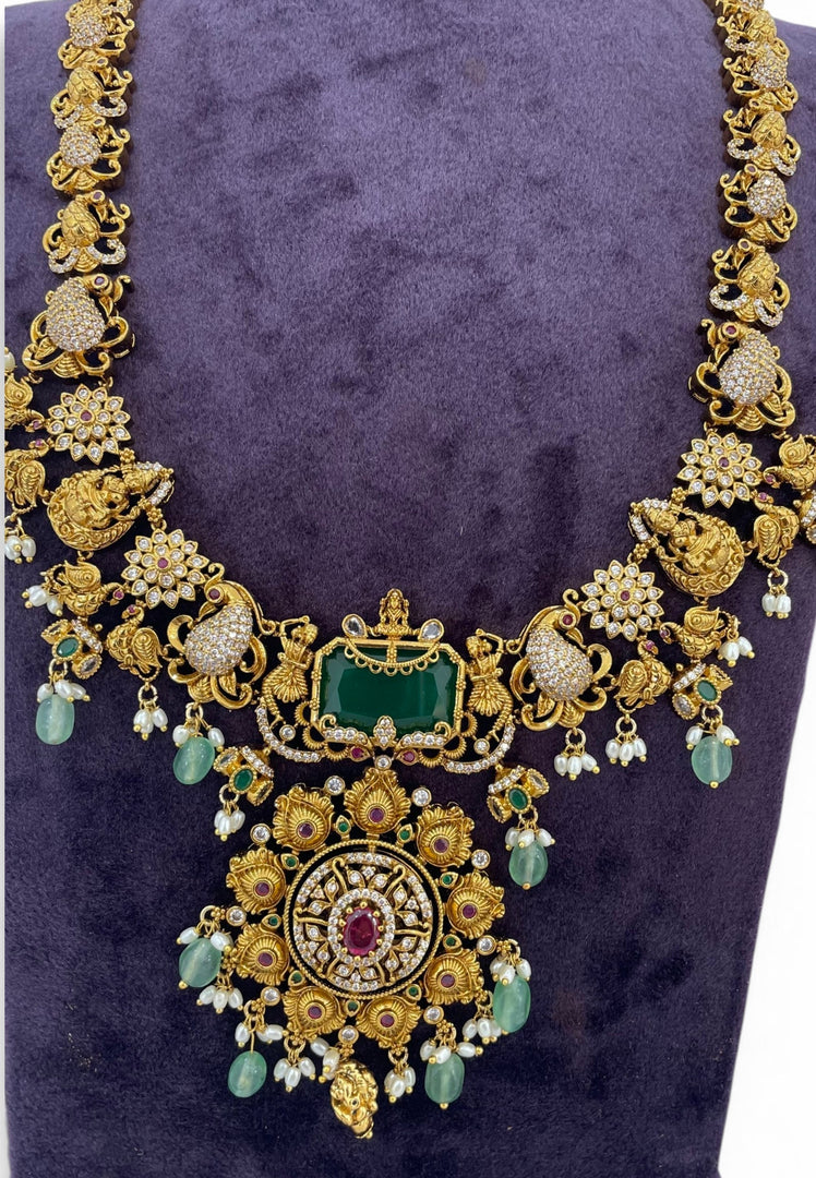 Traditional long haram with green beads and Laxmi Devi motive pendant