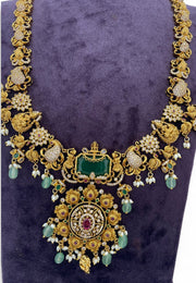 Traditional long haram with green beads and Laxmi Devi motive pendant