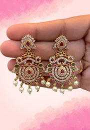 Beautiful earrings with uncut stone and pink stone
