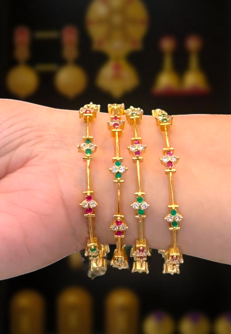 Beautiful bangle with Ruby and green stone