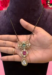 Beautiful short black beads chain with green and pink stone