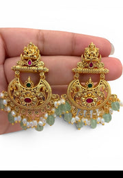 Traditional chandbali earrings with green beads