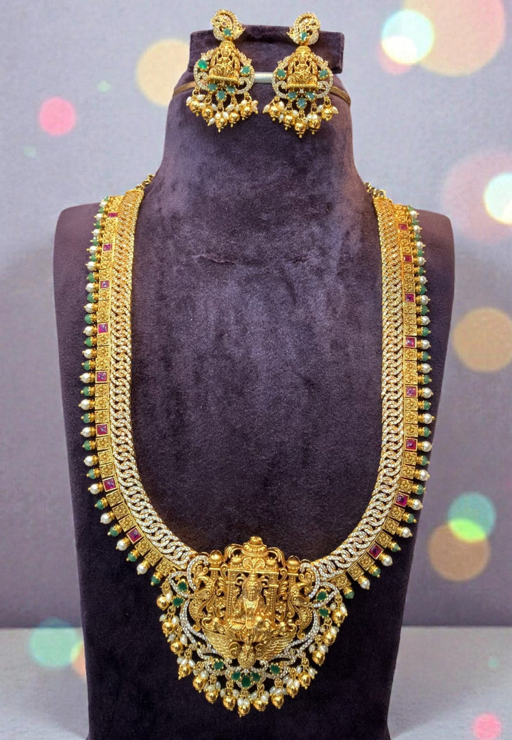 Traditional long jalebi pattern haram with Laxmi Devi motive and green stone