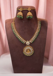 Beautiful short haram with gold finishing and green stone hangings