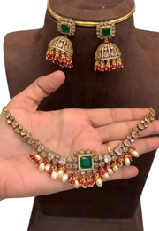 Beautiful short necklace with white hangings and green stone