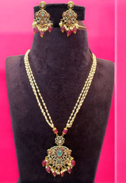 Three layer pearls set with green stone and ruby colour stone