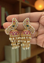 Beautiful jumkhas with green stone and peacock design