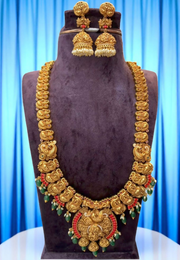 Beautiful traditional long haram with peacock design and coral , green stone combination