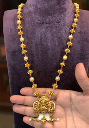 Traditional beads haram with puligoru design pendant and Laxmi Devi motive