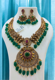 Stunning polki like short necklace with green beads and Stone