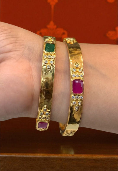 Beautiful gold finishing bangles with ruby and green stone