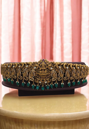 Beautiful looking hip belt with gold finishing and green beads with lakshmi motive